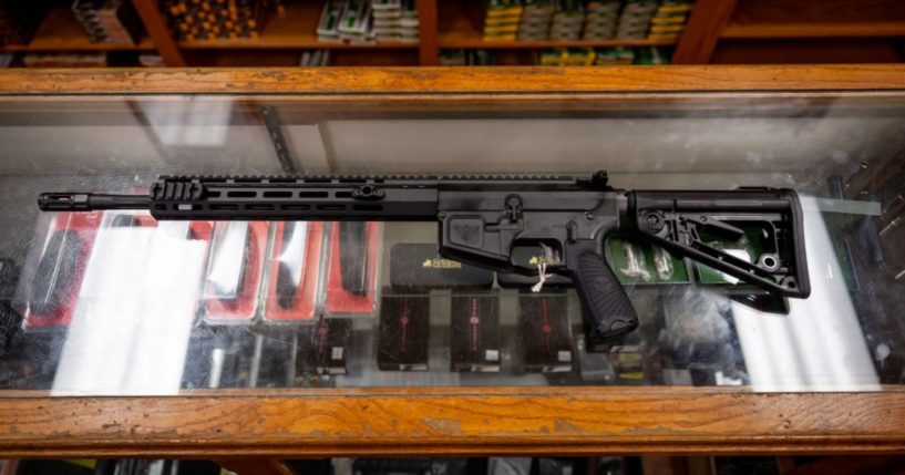 In this photo illustration, a semi-automatic AR-15 is displayed on a countertop at the McBride Guns Inc. store on August 25, 2023 in Austin, Texas.