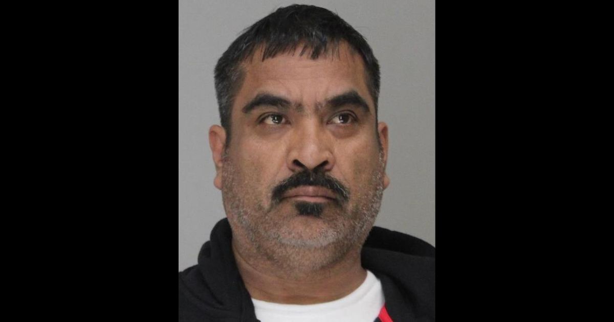 This is the mugshot of Jose Santiago Chairez, who stands accused of murdering two sisters and shooting his daughter.