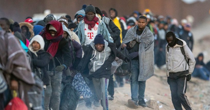 Immigrants, most from West Africa, wait to be processed by U.S. border officials after illegally crossing the U.S.-Mexico border on Wednesday in Lukeville, Arizona.