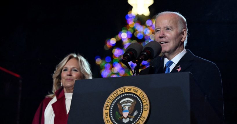 President Joe Biden speaks as First Lady Jill Biden looks on during the National Christmas tree lighting ceremony on the Ellipse of the White House in Washington, D.C., on Thursday.