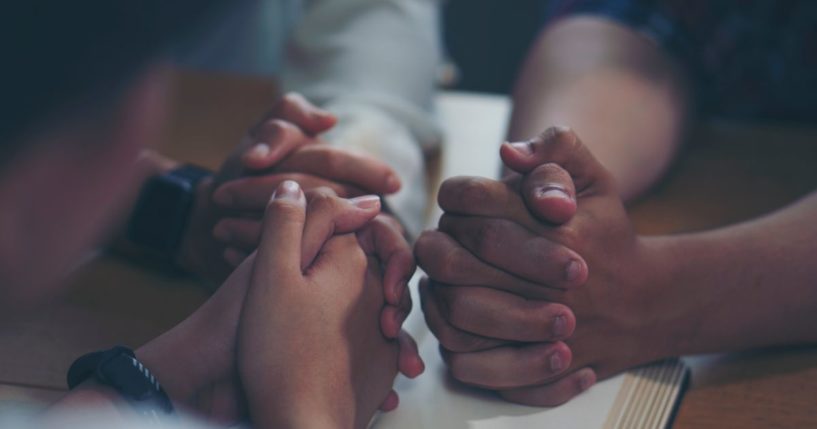 The above stock image is of people praying.