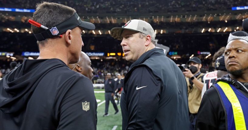 Arthur Smith, center, unloads on New Orleans Saints head coach Dennis Allen, left, after his Atlanta Falcons were routed in New Orleans.