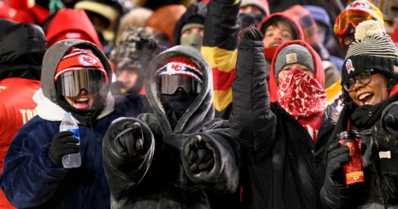 Kansas City Chiefs fans celebrated despite the below-zero temperatures during the second half of an NFL wild-card playoff football game against the Miami Dolphins, Saturday in Kansas City, Missouri.