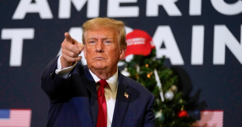 Donald Trump pointing at supporters during an Iowa rally