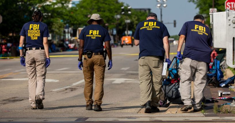 FBI agents work the scene of a shooting at a Fourth of July parade in Highland Park, Illinois, on July 5.