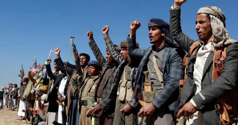 Houthi fighters and tribesmen stage a rally against U.S. and U.K. strikes on Houthi-run military sites near Sanaa, Yemen, on Sunday.