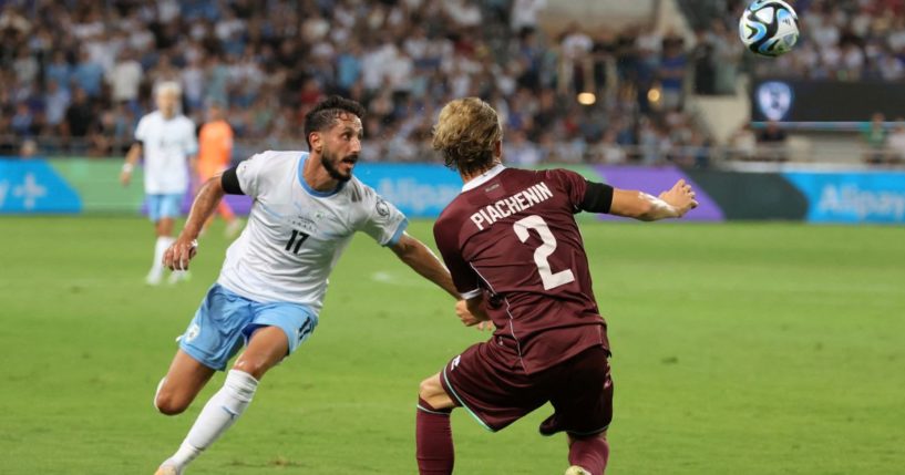 Israeli midfielder Sagiv Jehezkel and Belarus forward Kiryl Pyachenin vie for the ball during the UEFA Euro 2024 group I qualification football match at the Bloomfield stadium in Tel Aviv on Sept. 12.