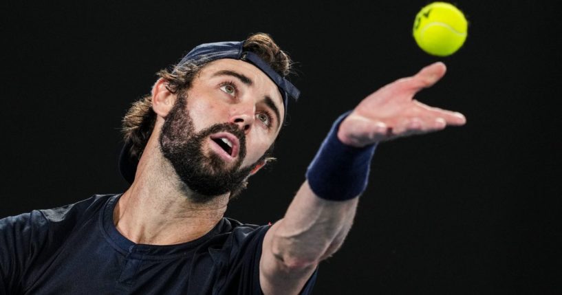 Jordan Thompson of Australia serves in the Men's Singles Second Round match against Stefanos Tsitsipas of Greece during day four of the 2024 Australian Open in Melbourne, Australia, on Wednesday.