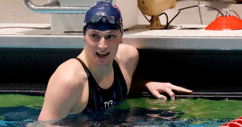 Transgender swimmer Lia Thomas smiles after winning the 100-yard freestyle final at the 2022 Ivy League Women's Swimming and Diving Championships while swimming for the Univesity of Pennsylvania women's team.