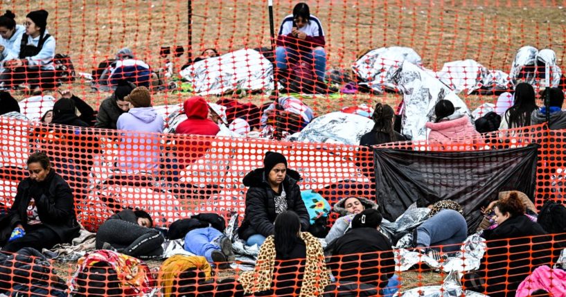 Immigrants wait to be processed at a U.S. Border Patrol transit center in Eagle Pass, Texas, on Dec. 22.