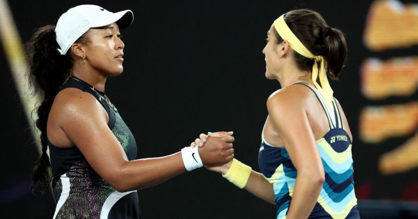 France's Caroline Garcia, right, shakes hands with Japan's Naomi Osaka after their women's singles match on day two of the Australian Open tennis tournament in Melbourne on Monday.