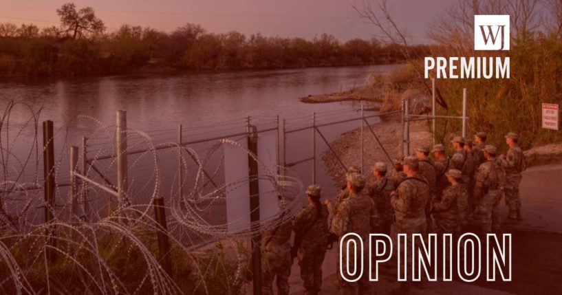 National Guard soldiers stand guard on the banks of the Rio Grande on Jan. 12 in Eagle Pass, Texas.