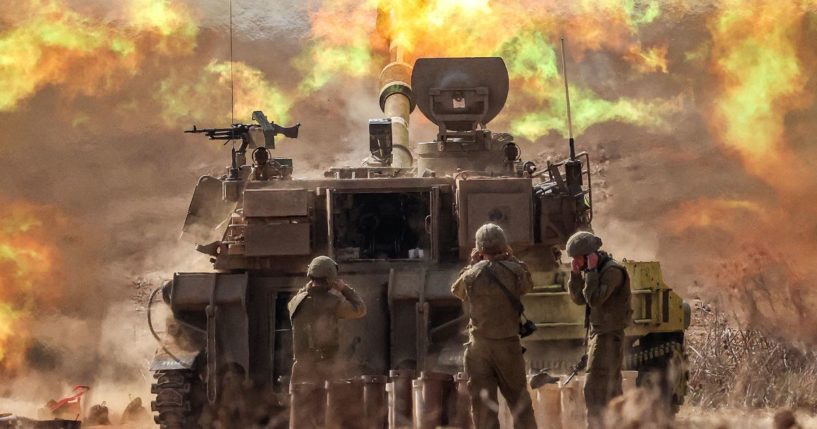 An Israeli army self-propelled howitzer fires rounds near the border with Gaza in southern Israel on Oct. 11.