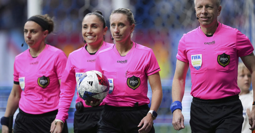 Referee Tori Penso, second from right; fourth official Felisha Mariscal, second from left; and assistant referees Brooke Mayo, left, and Corey Rockwell, right, walk onto the field before the Vancouver Whitecaps and Colorado Rapids played in an MLS soccer match April 29, 2023, in Vancouver, British Columbia. Major League Soccer will lock out referees after its union rejected a tentative contract, putting Lionel Messi’s Inter Miami on track to open the season with replacement officials.