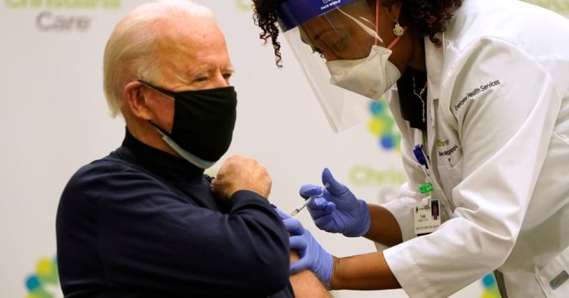 Joe Biden receives a COVID-19 vaccination from nurse practitioner Tabe Mase at ChristianaCare Christiana Hospital in Newark, Delaware, on Dec. 21, 2020.