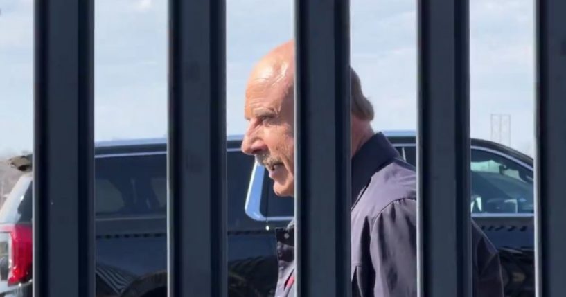 Dr. Phil reading a statement at the border