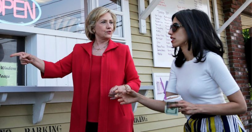 Hillary Clinton and her personal aide Huma Abedin approach a window to buy ice cream in New Hampshire during the 2016 primary