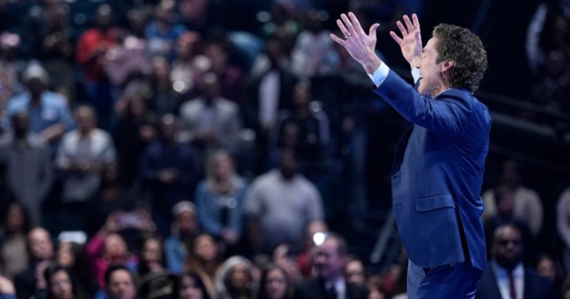 Pastor Joel Osteen preaches during a service at Lakewood Church Sunday, in Houston. Osteen welcomed worshippers back to Lakewood Church for the first time since a woman opened fire in between services at his Texas megachurch one week ago.