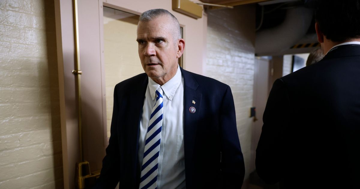 Rep. Matt Rosendale walking past reporters on his way to an afternoon Republican caucus meeting at the U.S. Capitol