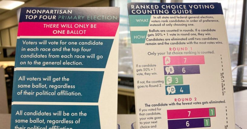 Brochures are displayed at the Alaska Division of Elections office in Anchorage, Alaska, on Jan. 21, 2022, detailing changes to elections.