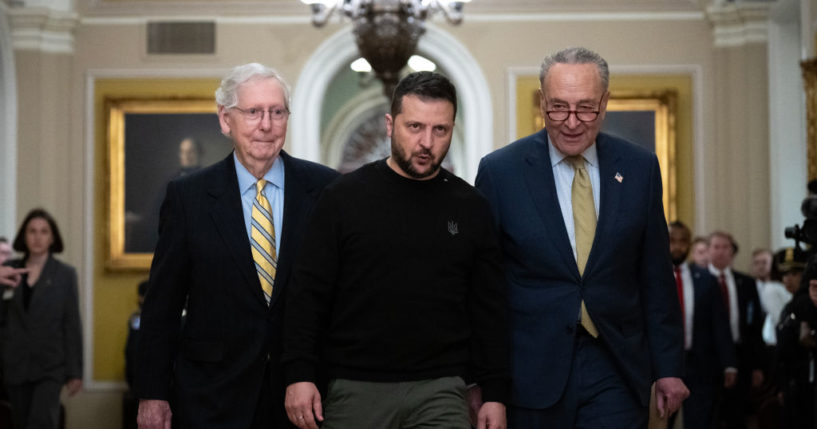 Walking with Senate Minority Leader Mitch McConnell (R-KY), left, and Senate Majority Leader Chuck Schumer (D-NY), right, Ukrainian President Volodymyr Zelenskyy arrives at the U.S. Capitol to meet with Congressional leadership on Dec. 12, in Washington, D.C.