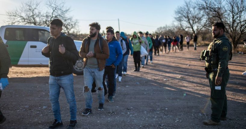 A group of illegal migrants are processed by Border Patrol on Sunday outside Eagle Pass, Texas.