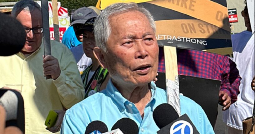 Actor George Takei, pictured in a September file photo from an actors' union picket line.