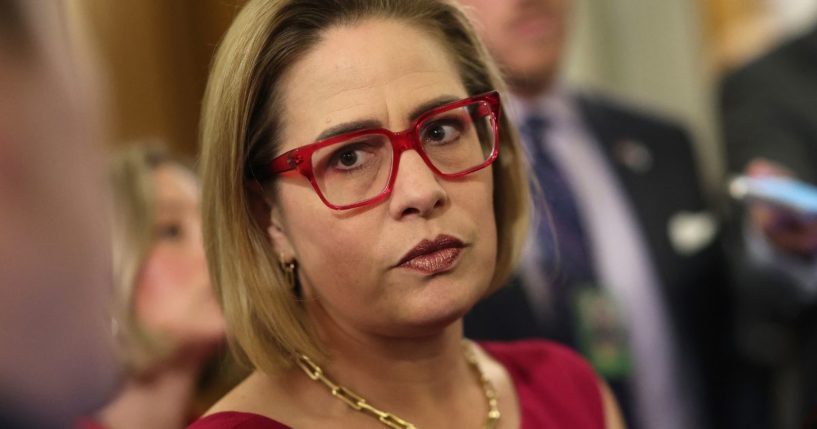 Sen. Kyrsten Sinema speaks to reporters at the U.S. Capitol on Feb. 5 in Washington, D.C.