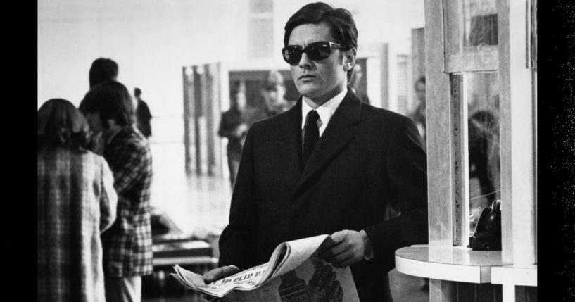 French actor Alain Delon stands in Fiumicino Airport, Rome, during the filming of 1969's 'The Sicilian Clan.'