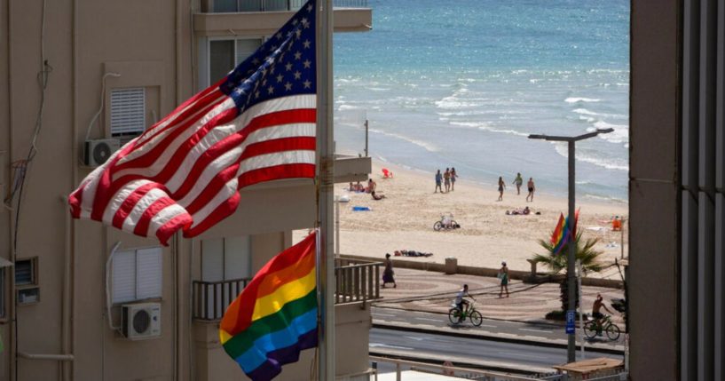 A U.S. flag is seen raised alongside a "pride" flag at the U.S. Embassy in Tel Aviv, Israel, in 2014.