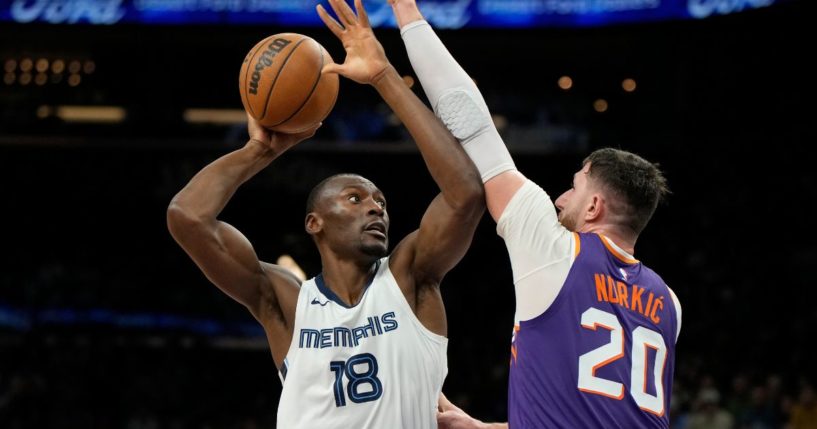 Bismack Biyombo, left, then with the Memphis Grizzlies, shoots over Phoenix Suns center Jusuf Nurkic during a Jan. 7 game in Phoenix. He joined the Oklahoma City Thunder on Feb. 10.