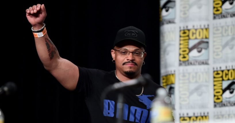 Beau DeMayo with a raised hand at the Marvel Studios' Animation presentation at 2022's Sand Diego Comic-Con.