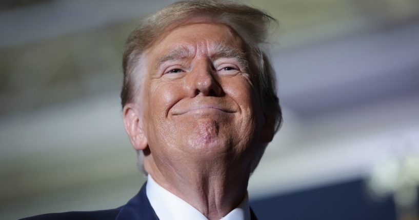 Former President Donald Trump smiles at supporters after speaking at a Get Out The Vote rally in North Charleston, South Carolina, on Feb. 14.