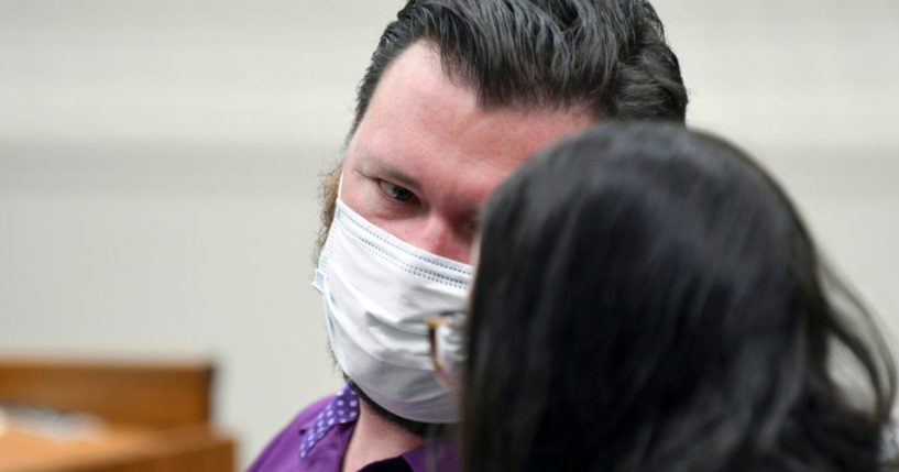 Miles Harford appears in court to hear the charges against him, Friday, in Denver. Harford, a former funeral home owner accused of keeping a woman's corpse in the back of a hearse for two years and hoarding the cremated remains of 35 people, has been charged with forgery, theft and abuse of a corpse.