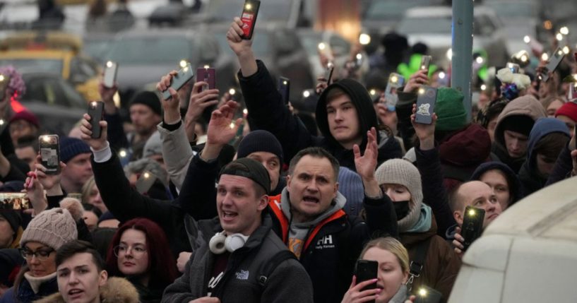 People walk toward the Borisovskoye Cemetery for the March 1 funeral ceremony of Russian opposition leader Alexei Navalny, in Moscow.