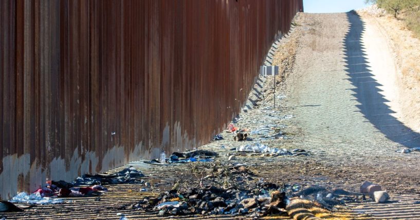 Ashes from a bonfire and clothes are pictured next to the U.S.-Mexico border wall in Sasabe, Arizona, on Dec. 5.