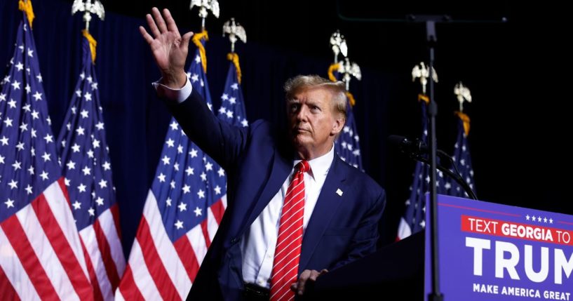 Former President Donald Trump leaves the stage at the conclusion of a campaign rally on March 9 in Rome, Georgia.