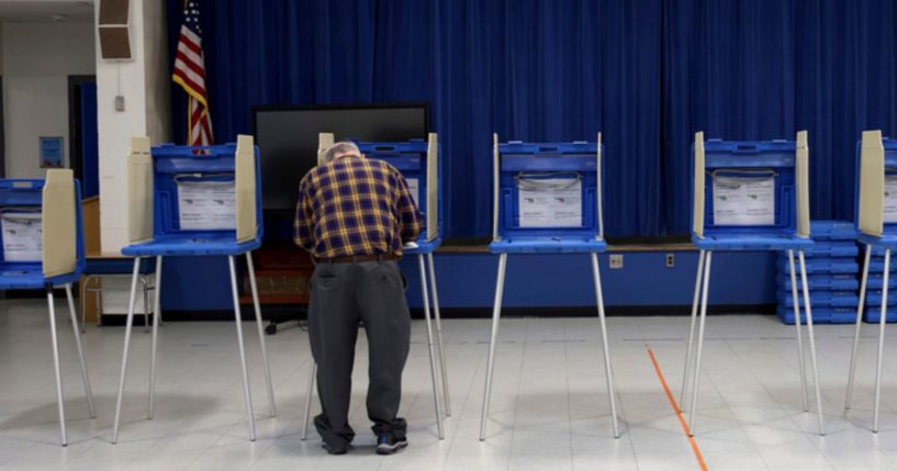 A voter casts his ballot at a polling station in Warwick, R.hode Island, during the state's primary election Tuesday.