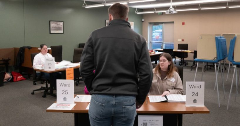 A resident arrives to vote in Wisconsin's primary election at a polling location in Green Bay on Tuesday.