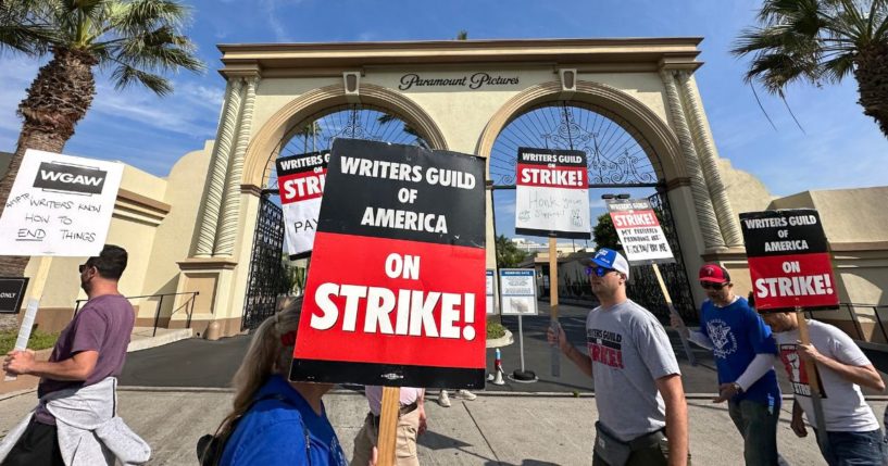 Picketers with the Writers Guild of America walk the line outside Paramount Studios in Los Angeles on Sept. 22.