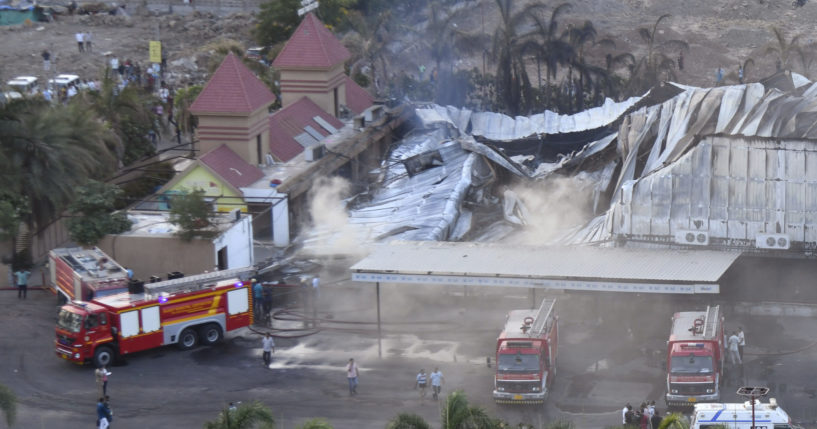 Firefighters douse a fire which broke out in an amusement park in Rajkot, in the Indian state of Gujarat, on May 25, 2024.