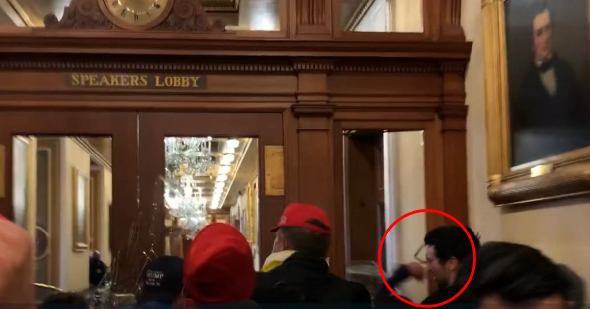Ashli Babbitt punches Zachary Alam in the U.S. Capitol on Jan. 6, 2021.