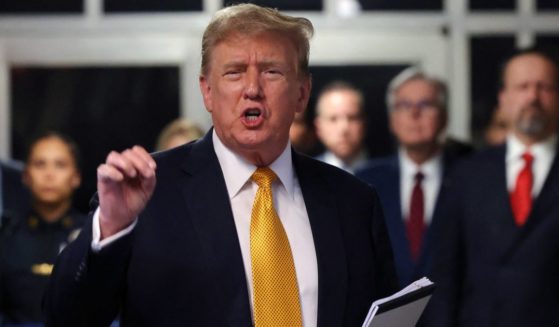 Former President Donald Trump speaks to the media as he returns from a break in his criminal trial at Manhattan Criminal Court in New York City on Tuesday.