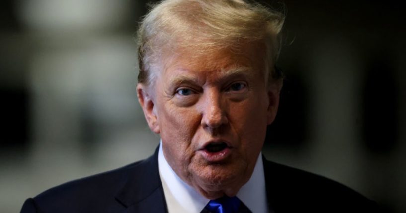 Former President Donald Trump speaks to the media as he arrives at the Manhattan Criminal Court in New York City on Thursday.