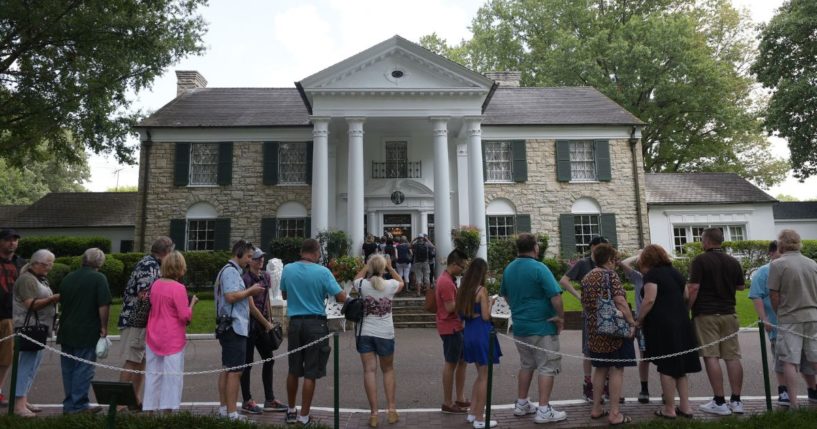 Visitors line up to enter the Graceland mansion of Elvis Presley in Memphis, Tennessee, on Aug. 12, 2017.