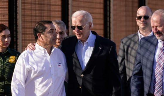 Joe Biden talking with Henry Cuellar