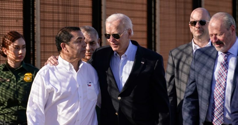 Joe Biden talking with Henry Cuellar