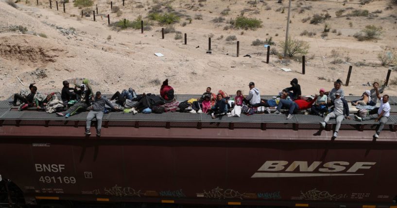 Illegal Immigrants travel on freight cars of the Mexican train known as "The Beast" as they arrive at the border city of Ciudad Juarez, in Chihuahua state, Mexico, on April 24.