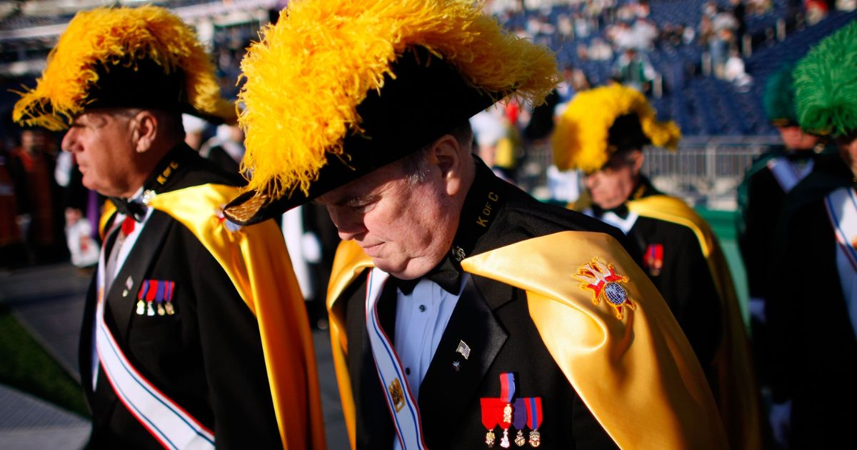 Members of the Knights of Columbus arrive before Pope Benedict XVI celebrates Mass at Nationals Park in Washington on April 17, 2008.