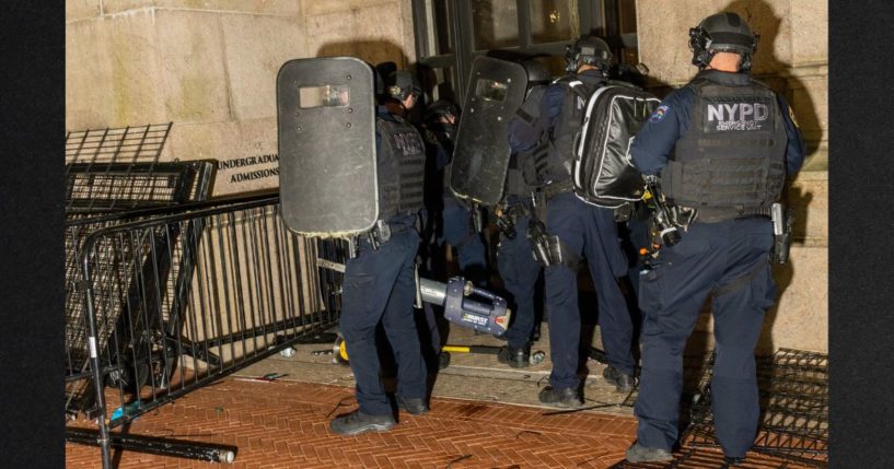 Members of the NYPD surround and breach Hamilton Hall where demonstrators barricaded themselves inside on the Columbia University campus Tuesday in New York City. Police arrested nearly 100 people as they cleared the university of demonstrators who were issued a notice to disband their encampment after negotiations failed to come to a resolution. Now Columbia Law Review students are demanding that their final exams be cancelled because of the trauma of having police on their campus.